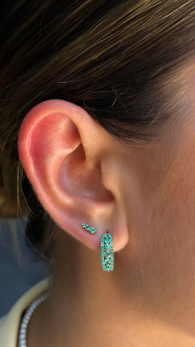 Graduated Lab Emerald Drop Earrings. worn